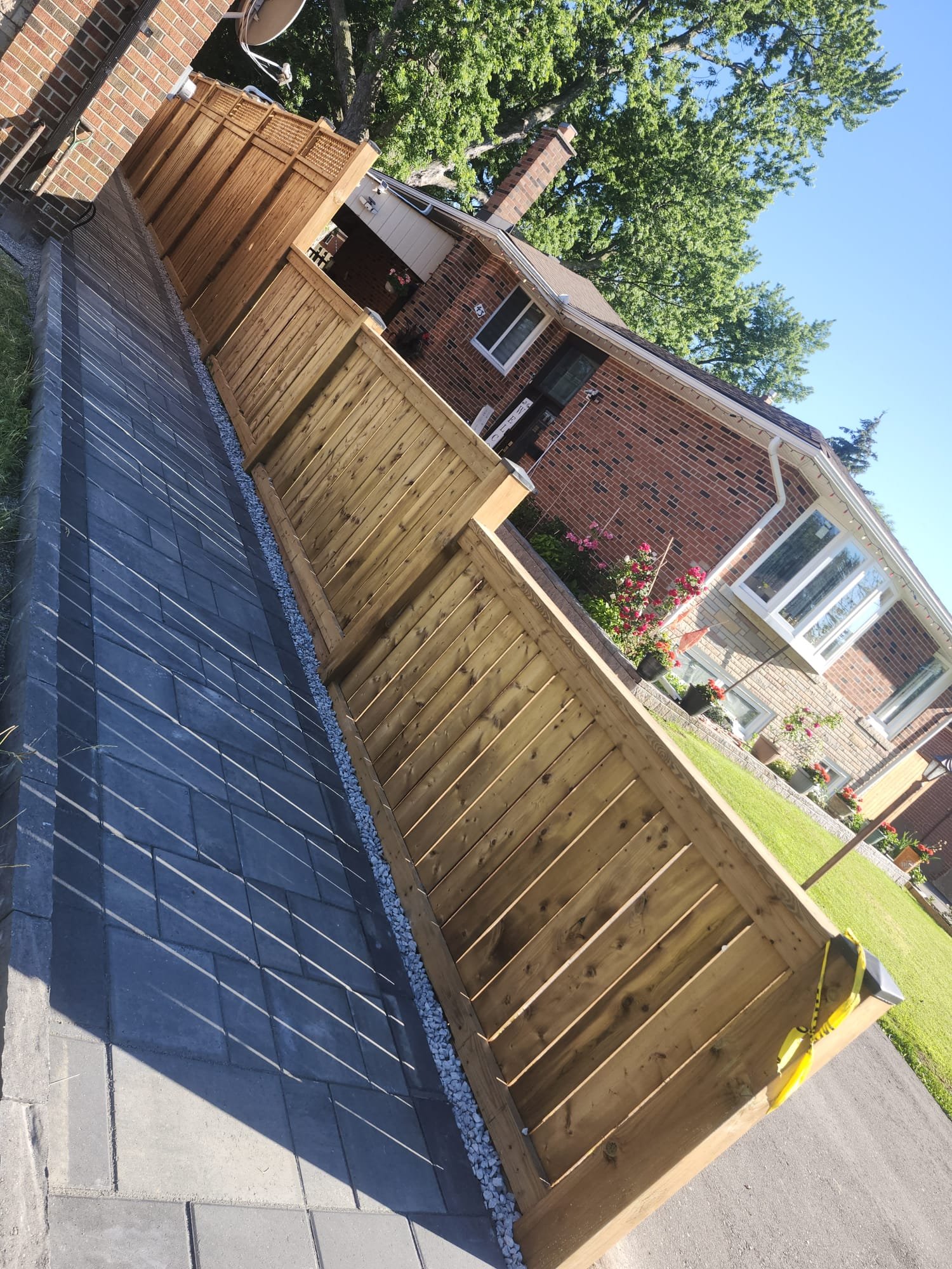 Cedar fence and interlock walkway