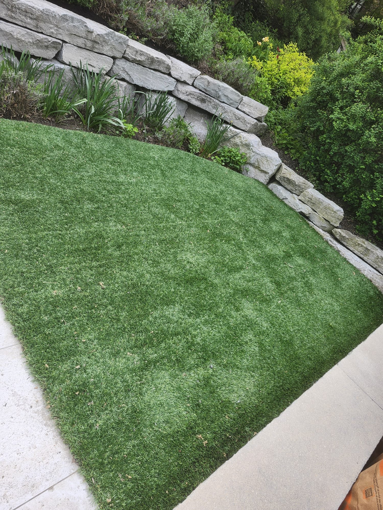 Lawn and natural stone wall
