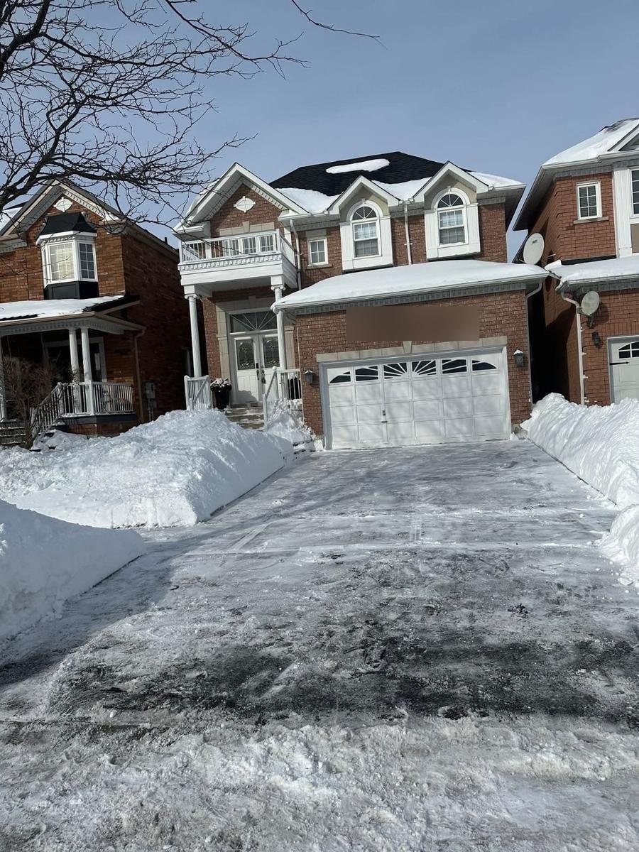 Driveway cleared with deep snow banks